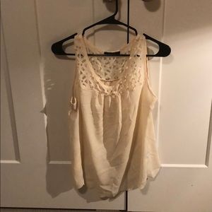 Cream colored top with delicate punched neckline